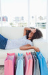 Portrait of a tired woman lying on her sofa 