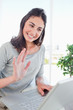 Portrait of a beaming student on a video chat