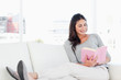 Smiling woman with a novel