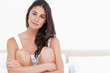 Portrait of a young brunette on her bed