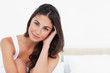 Portrait of a fresh brunette on her bed