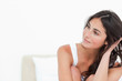 Portrait of a thoughtful brunette on her bed