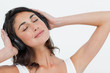 Foto: Close-up of a brunette listening to music Close-up of a brunette listening to music