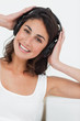 Foto: Portrait of a smiling brunette listening to music Portrait of a smiling brunette listening to music
