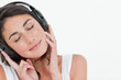 Close-up of a brunette enjoying music