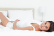 Portrait of a brunette lying on her back