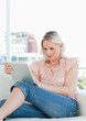 Close-up of a blonde using a touchpad