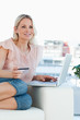 Blonde shopping online with a laptop