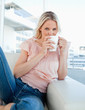 Portrait of a blonde drinking a coffee