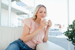 Blonde smelling her tea