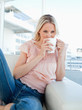 Blonde drinking a coffee
