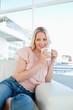 Happy blonde with a coffee
