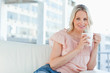 Portrait of a blonde with a cappuccino 