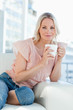 Blonde with a white coffee 