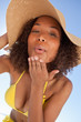 Young woman looking at the camera with puckered lips