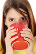 Young beautiful girl is drinking cup of tea.