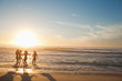 Four women wading in the water