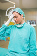 Tired nurse putting hand on her forehead