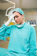 Tired nurse looking at camera