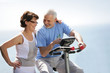 Senior couple with an exercise bike