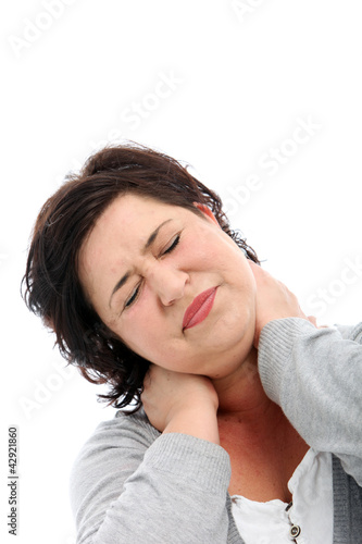 Photo: Woman stretching her head to one side to alleviate Woman stretching her head to one side to alleviate