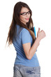 Photo: Smiling girl shows thumb up. Smiling girl shows thumb up.