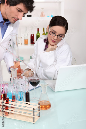 Photo: Scientists conducting an experimet Scientists conducting an experimet