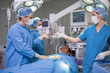 Male patient being operated by a team of surgeons