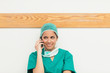 Woman smiling while sitting on the floor and phoning