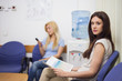 Two patients sitting in the waiting room