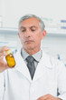 Pharmacist holding a bottle full of pills