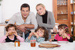 Young family having breakfast