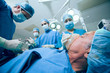 Surgery team in an operating theater operating a patient