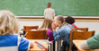 Schoolgirl whispering into schoolfellows ears
