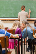 Back view of girls talking during class