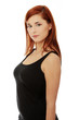 Young red-hair woman standing and looking