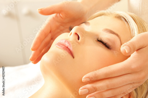 Photo: beautiful woman in massage salon beautiful woman in massage salon