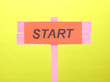 Start wooden board on green background