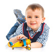 Foto: Cute little boy playing with a toy airplane Cute little boy playing with a toy airplane