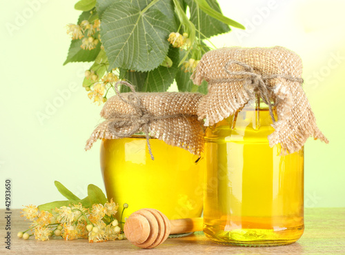Photo: jars with linden honey and flowers jars with linden honey and flowers