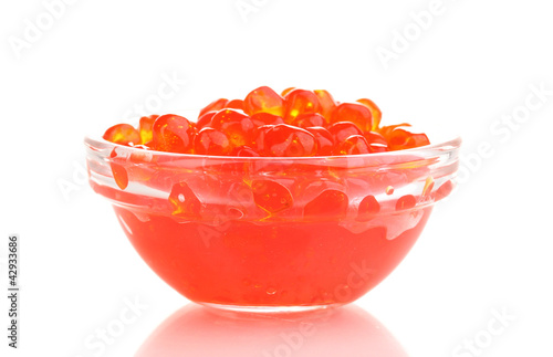 Photo: Red caviar in glass bowl isolated on white Red caviar in glass bowl isolated on white