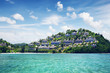 Over water bungalows in palms nature with beach