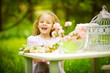 Photo: Beautiful girl in spring garden with flowers Beautiful girl in spring garden with flowers