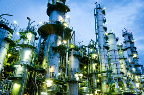 Photo: Column tower in petrochemical plant at twilight Column tower in petrochemical plant at twilight