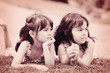 Two sisters outdoors. Sepia toning