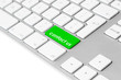 Computer keyboard with green “contact us” button