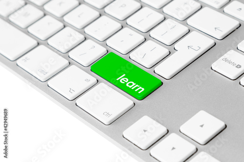 Photo: Computer keyboard with green “learn” key. Internet e-learning. Computer keyboard with green “learn” key. Internet e-learning.