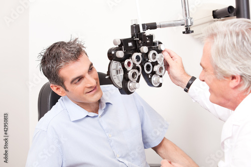 Photo: Optometrist doing Sight Testing Optometrist doing Sight Testing