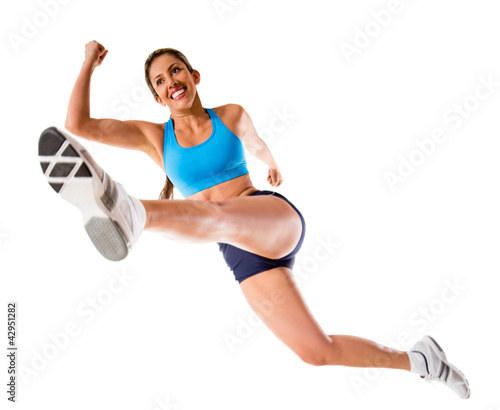 Photo: Female athlete jumping Female athlete jumping