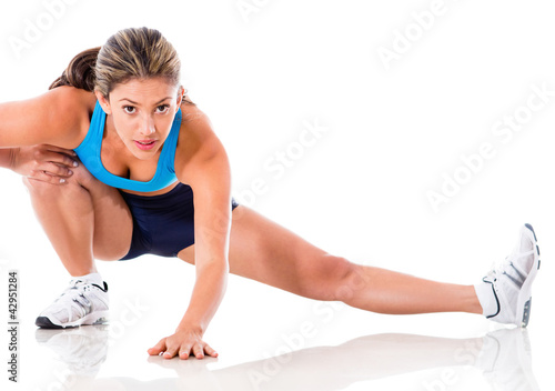 Photo: Female athlete stretching Female athlete stretching
